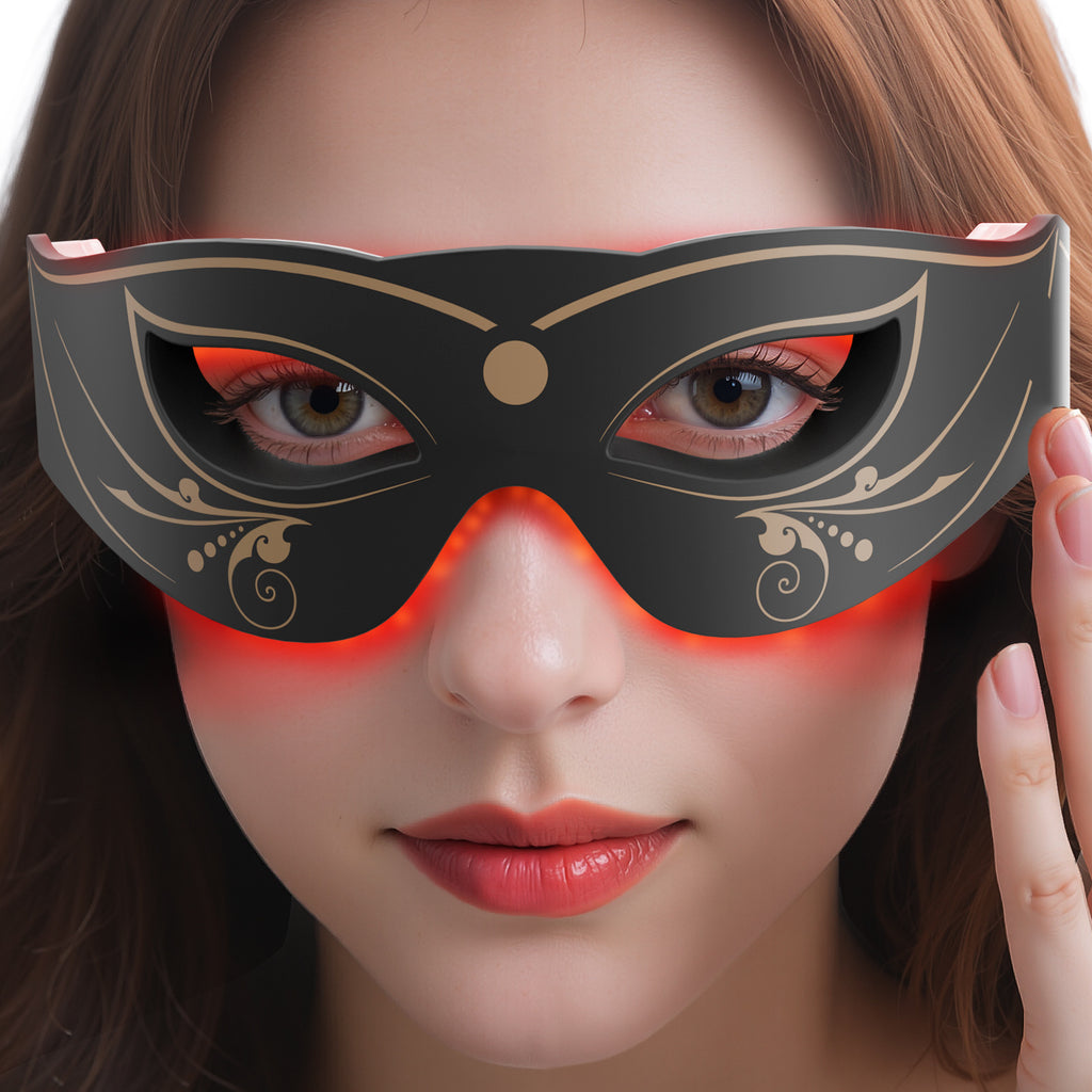 Woman wearing a decorative black mask with red lighting.