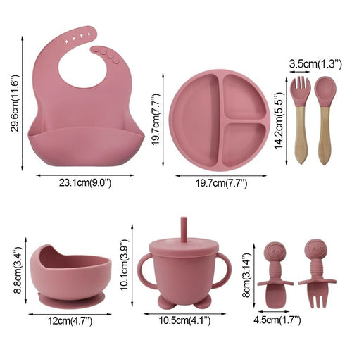 Baby feeding set with bib, plate, cup, and utensils with measurements on a white background