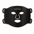 Black face mask with geometric pattern on a white background