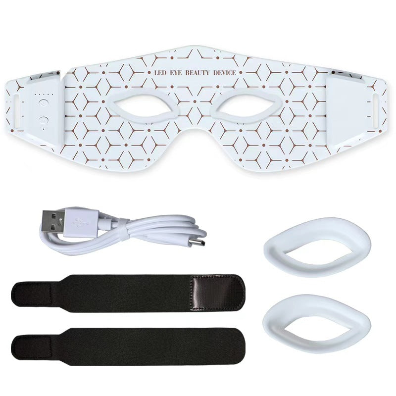 LED eye beauty device with accessories on a white background