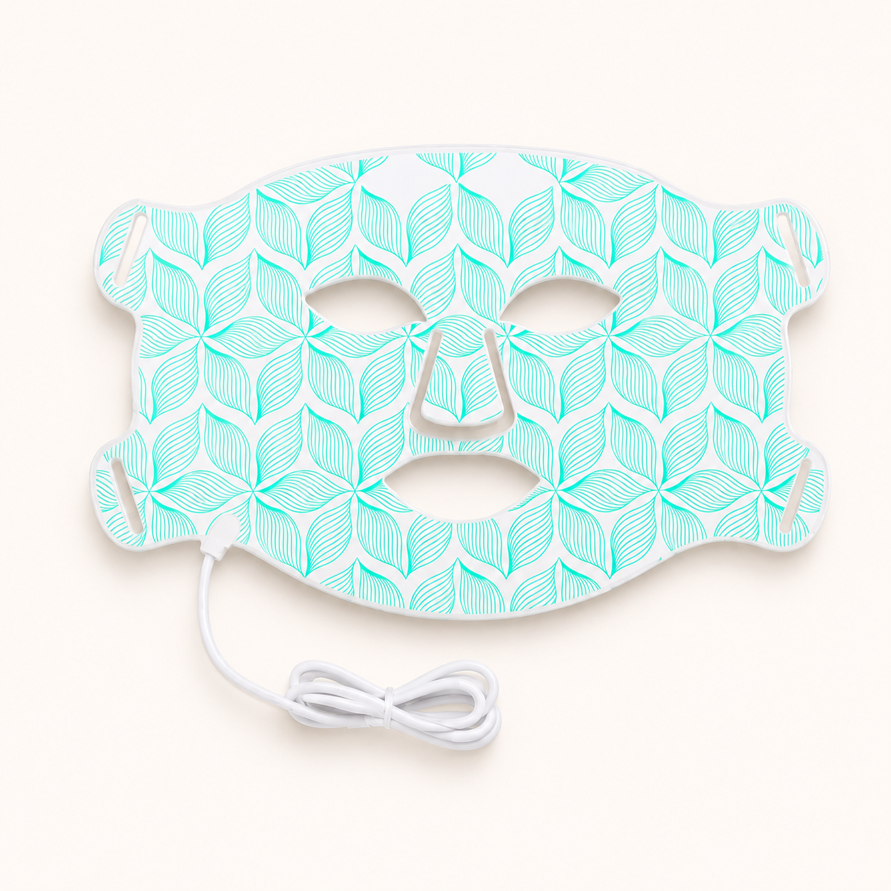 Teal patterned face mask with a white cord on a light beige background